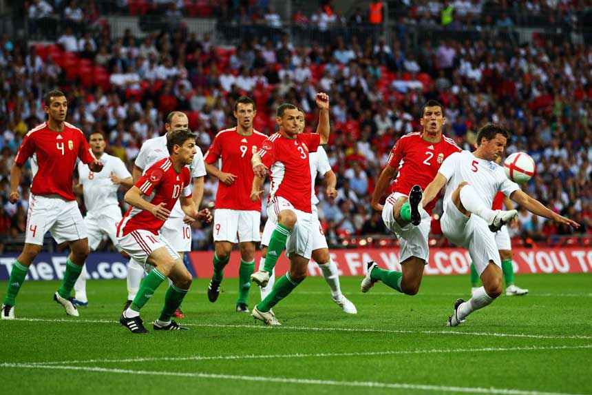 Phil Jagielka attacks a corner against Hungary.